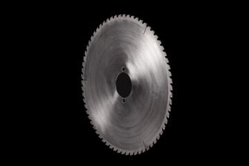 Massive circular saw blade isolated on a black background
