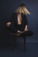 woman sitting on a chair. Boudoir photography.