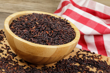 Wooden Bowl of delicious and healthy Black Rice