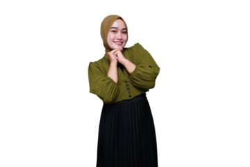 Smiling asian hijab woman keeps hands under chin
