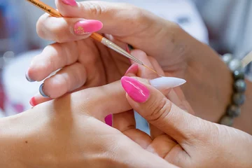 Badezimmer Foto Rückwand closeup of manicurist doing nail art to a client © dark_blade