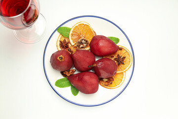 Tasty and delicious food concept - pear in wine