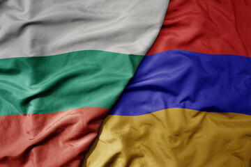 big waving national colorful flag of bulgaria and national flag of armenia .