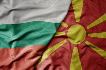 big waving national colorful flag of bulgaria and national flag of macedonia .