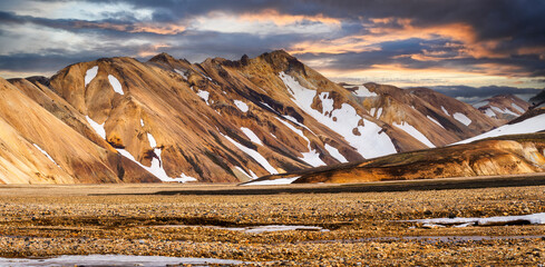 Icelandic volcanic mountain with dramatic sky on wilderness in Landmannalaugar at Iceland
