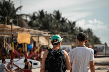 Obraz premium mother and son are walking in the streets of isla holbox, mexico
