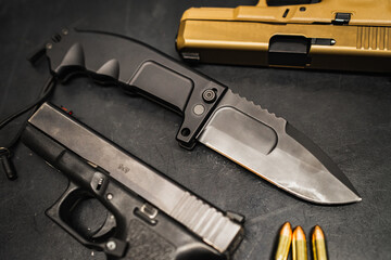 Firearms and steel arms.  Folding tactical knife and pistols.