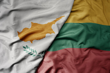 big waving national colorful flag of cyprus and national flag of lithuania .