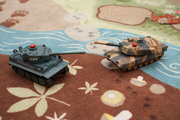 children's toys, playing tanks on the carpet, tanks on the remote control