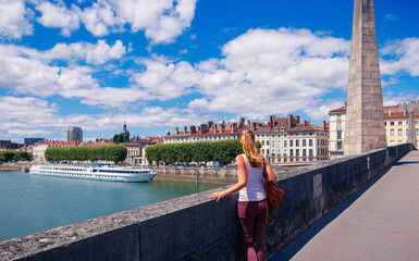 Woman enjoying view of Chalon-sur-Saone,  city in Burgundy in France