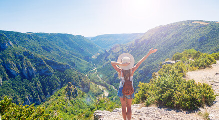 Woman looking at view from mountain- tourism,adventure,wanderlust
