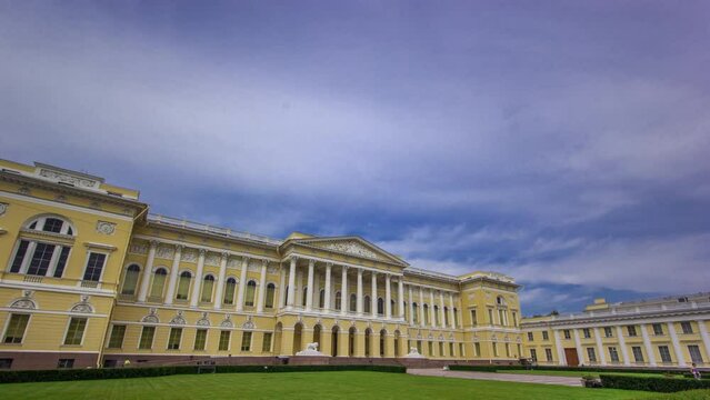 The State Russian Museum Hyperlapse - Showcasing the World's Largest Collection of Russian Art. Captured under a Blue Cloudy Sky with a Lush Green Lawn. St. Petersburg, Russia.