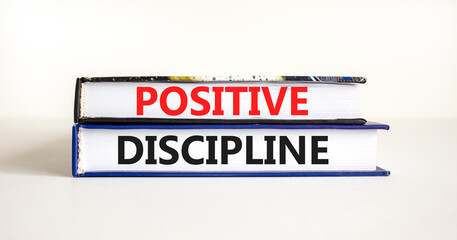 Positive discipline symbol. Concept words Positive discipline on beautiful books. Beautiful white table white background. Business psychology positive discipline concept. Copy space.