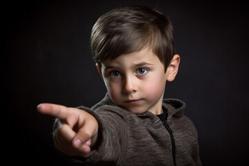 Medium shot portrait photography of a tender boy in his 30s making a gesture of i'm thinking with the finger on the head against a metallic silver background. With generative AI technology