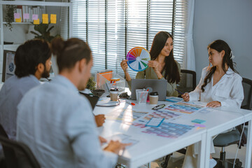 Fototapeta premium Startup team collaborates on color selection for user centric product design, optimizing experience