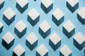 Pattern of sugar cubes on white background