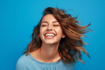 Close-up portrait photography of a joyful girl in her 30s giving a hug to the camera against a periwinkle blue background. With generative AI technology