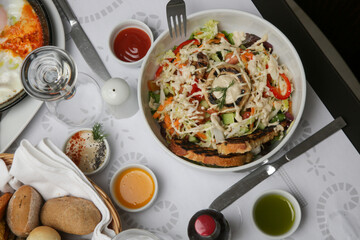 Vegetable salad and toast bread served in a bowl	