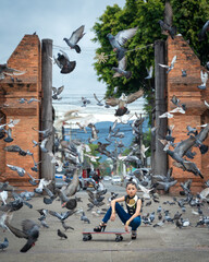 Obraz premium Pretty teenage young Asian women in a modern dress fashion contemporary is posted at Tha Phae Gate, a Landmark of the old city of Chang Mai, Thailand.