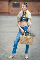 Pretty teenage young Asian women in a modern dress fashion contemporary is posted at Tha Phae Gate,...