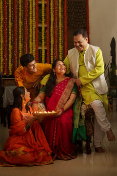 Portrait Of Happy Indian Family Celebrating Diwali Together At Home