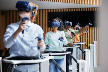 Diverse teen friends using vr gear