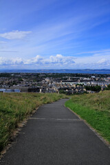 The high angle view of Edinburgh landscape from the mountain where near the National Monument of Scotland, England, UK. Cityscape of Edinburgh. Travel and nature scene.