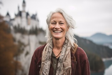 Medium shot portrait photography of a grinning mature woman frowning showing off a lace bralette at the neuschwanstein castle germany. With generative AI technology - obrazy, fototapety, plakaty