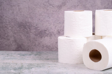 Toilet paper. Toilet paper rolls on gray background. Copy space