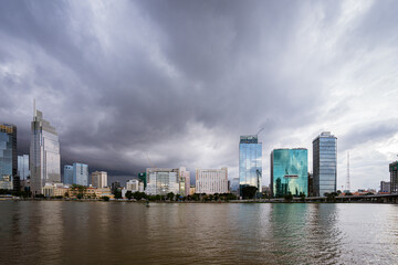 Fototapeta na wymiar View of Ho Chi Minh City from District 2, dark clouds are pulling towards the center