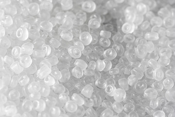 Background of transparent plastic granules. Abstract background.