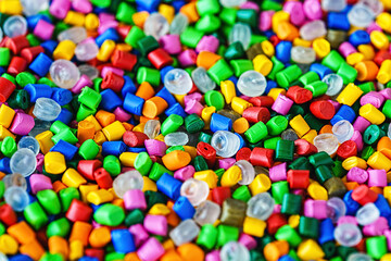 Fototapeta na wymiar background from colored plastic granules macro shot. abstract background from plastic dye