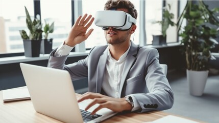 Businessman in VR headset with laptop sitting in office, Virtual reality.