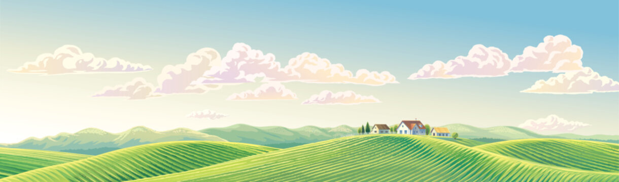 Summer rural landscape panoramic format, with hills and agriculture fields and village, on top of a hill.