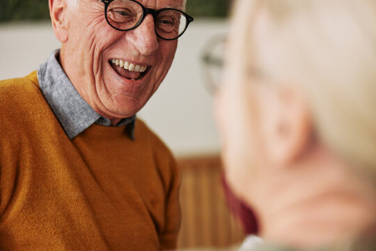 Laughing senior man talking with his wife