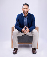 Portrait, smile and business man on chair in studio isolated on a white background mockup space....