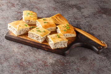 Sausage and Cheese Crescent Squares pie close-up on a board on the table. Horizontal