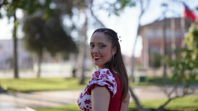 head shot portrait smiling young adult woman dressing chilean traditional huaso costume on the street