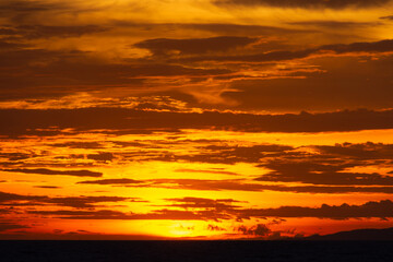 Fiery red sunset over the sea. A terrible bloody evening