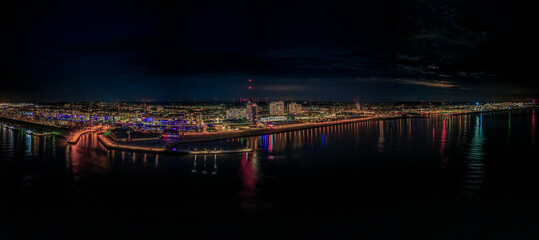 The beautiful skyline of Bremerhaven at night, panoramic aerial view of the city and its lights, Germany at night, travel destination in Northern Germany, summer time on the Weser river, Cityscape