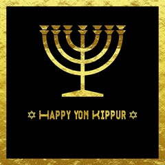 Golden Wish card Happy Yom Kippur written in English with 2 crosses of David and a candlestick menorah on a black frame