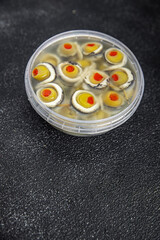 olive stuffed anchovy fillets, anchovy roll stuffed olives apetizing seafood pickled fish marinated ready to eat appetizer meal food snack on the table copy space food background rustic top
