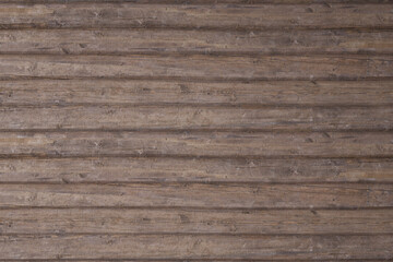 Seamless natural wood log cabin wall background texture. Rustic old grunge brown timber logs tileable repeat surface pattern. A high resolution backdrop 3D rendering.