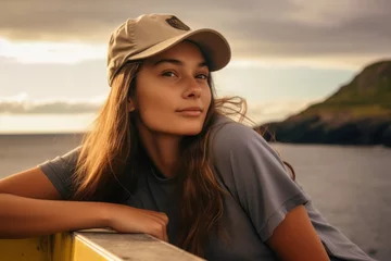 Foto op Canvas Photography in the style of pensive portraiture of a cheerful girl in her 20s wearing a casual baseball cap at the galapagos islands ecuador. With generative AI technology © Markus Schröder