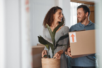 Moving, new home or happy couple with boxes in real estate, property or rental apartment. Woman,...