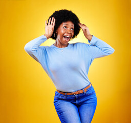 Happy black woman, wow and excited winner in celebration isolated on a yellow background in studio. Smile, surprise and shocked African person in achievement success, bonus promotion and good news.