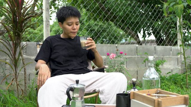  Enjoyment, Asian single dinking coffee in the garden