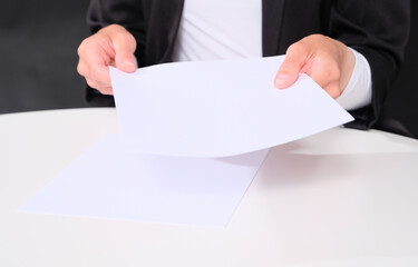 Businesswoman analyzes / reads documents before a deal