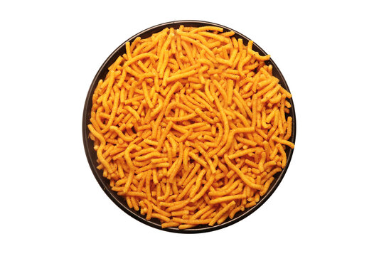 Close up of Spicy Aloo Bhujia on a black Ceramic bowl, made with Red chili, Potatoes, and Chickpeas. Indian spicy snacks (Namkeen), Top View
