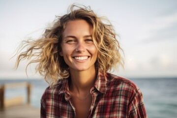 Photography in the style of pensive portraiture of a cheerful girl in her 30s wearing a relaxed flannel shirt at the great barrier reef in queensland australia. With generative AI technology